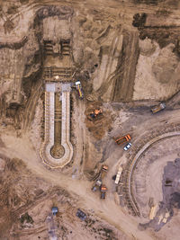 Russia, dagestan, derbent, aerial view of construction site in sandy area