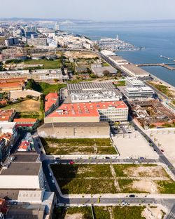 Aerial view of braco da prata industrial area along tagus river in lisbon, portugal.