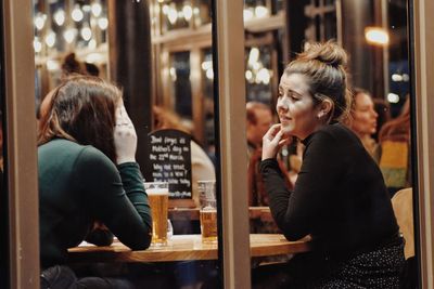 Woman sitting in restaurant