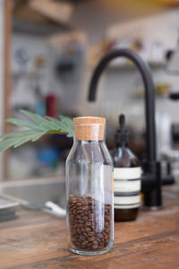 Close-up of drink in glass jar on table