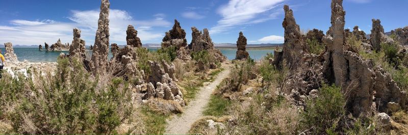 Panoramic shot of rocks on land against sky