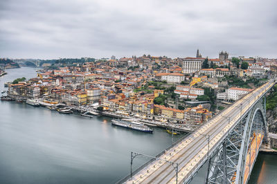 High angle view of river amidst buildings in city