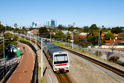 View of road and cityscape against clear sky