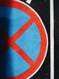 High angle view of arrow sign on road