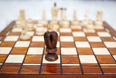 Close-up of chess pieces on board