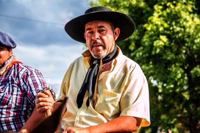 Portrait of man wearing cowboy hat