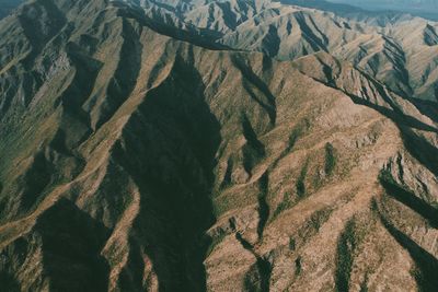 High angle view of sun shining over mountain