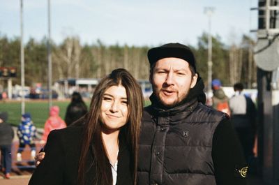 Portrait of smiling man and woman in winter