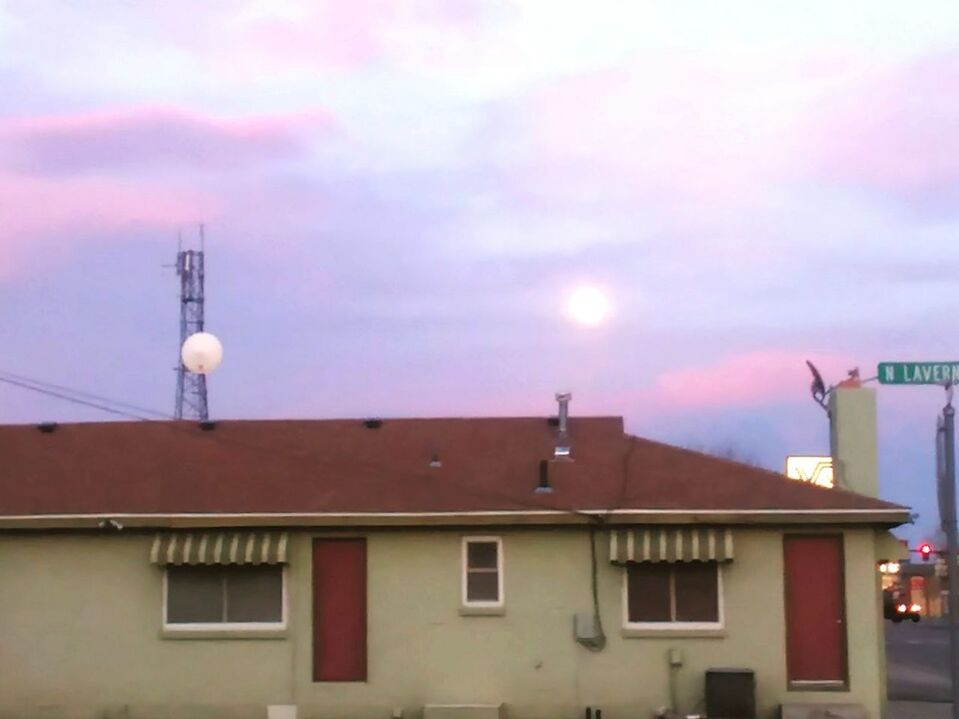 COMMUNICATIONS TOWER AGAINST SKY IN CITY