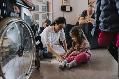 Parents with daughter in living room