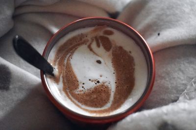 High angle view of coffee cup on table