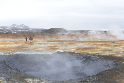 Landscape of namafjall hverir sulfuric area and tourists