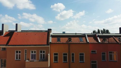 Houses against sky in city