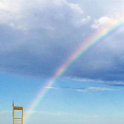 Low angle view of rainbow against sky