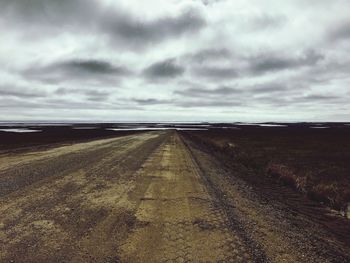 Road against cloudy sky