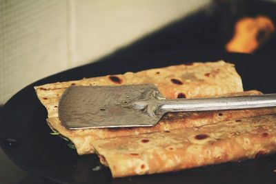 High angle view of bread on rusty metal