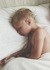 Cute child sleeping in bed