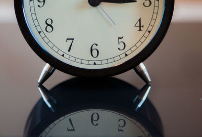 Close-up of alarm clock on table