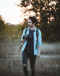 Full length of man standing on field