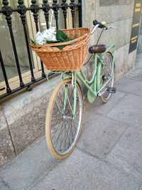 Bicycle parked on footpath by street