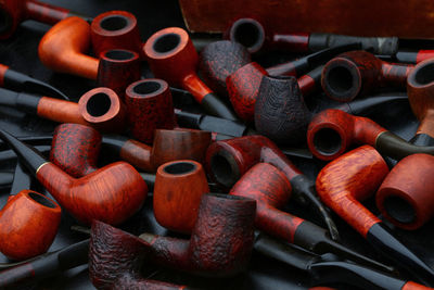 Close-up of smoking pipes on table