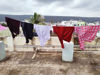 Clothes drying on clothesline against sky