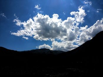 Scenic view of silhouette mountains against sky