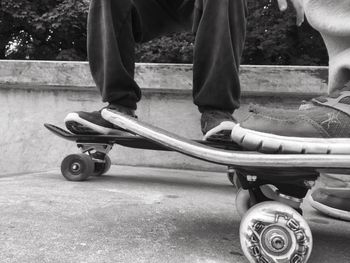 Low section of people skateboarding at park