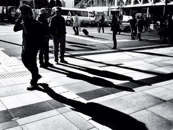 Shadow of people on street