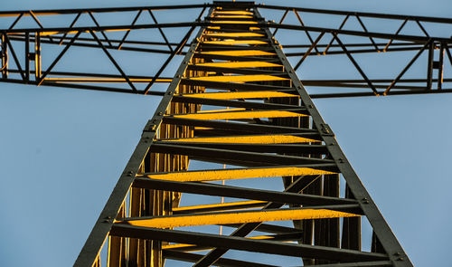 Low angle view of metallic structure against sky