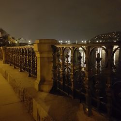 Illuminated row against sky at night