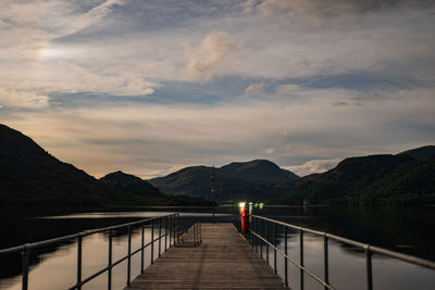 A moonlit view looking down aira force steamer jetty on ullswater in the english lake district