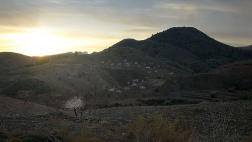 Scenic view of mountains against sky during sunset