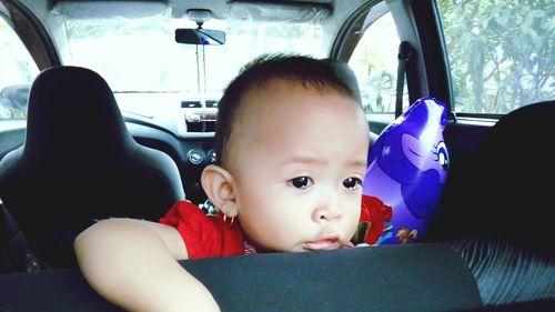 Cute boy relaxing in bus