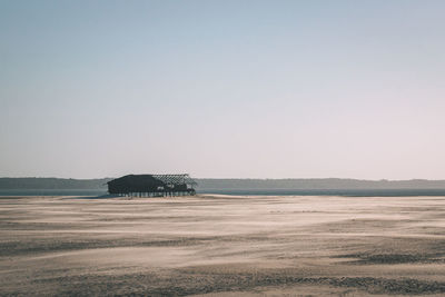 Scenic view of desert against clear sky