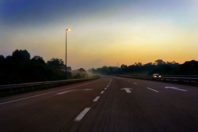 Road against sky at sunset