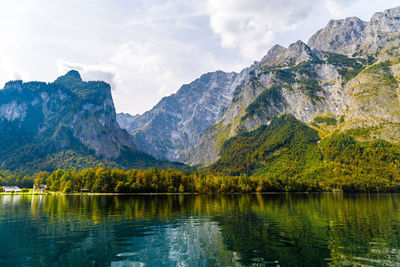 Scenic view of lake and mountains against sky