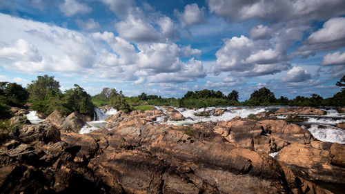 Panoramic view of rocks on landscape against sky