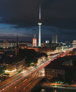 High angle view of illuminated buildings in city at night