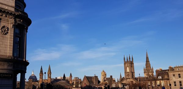 Panoramic view of buildings in city against sky