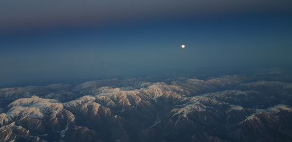 Scenic view of landscape against sky at night