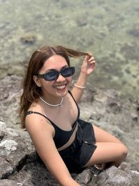 Portrait of young woman wearing sunglasses