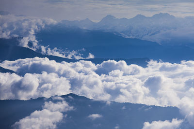 Aerial view of clouds over mountains