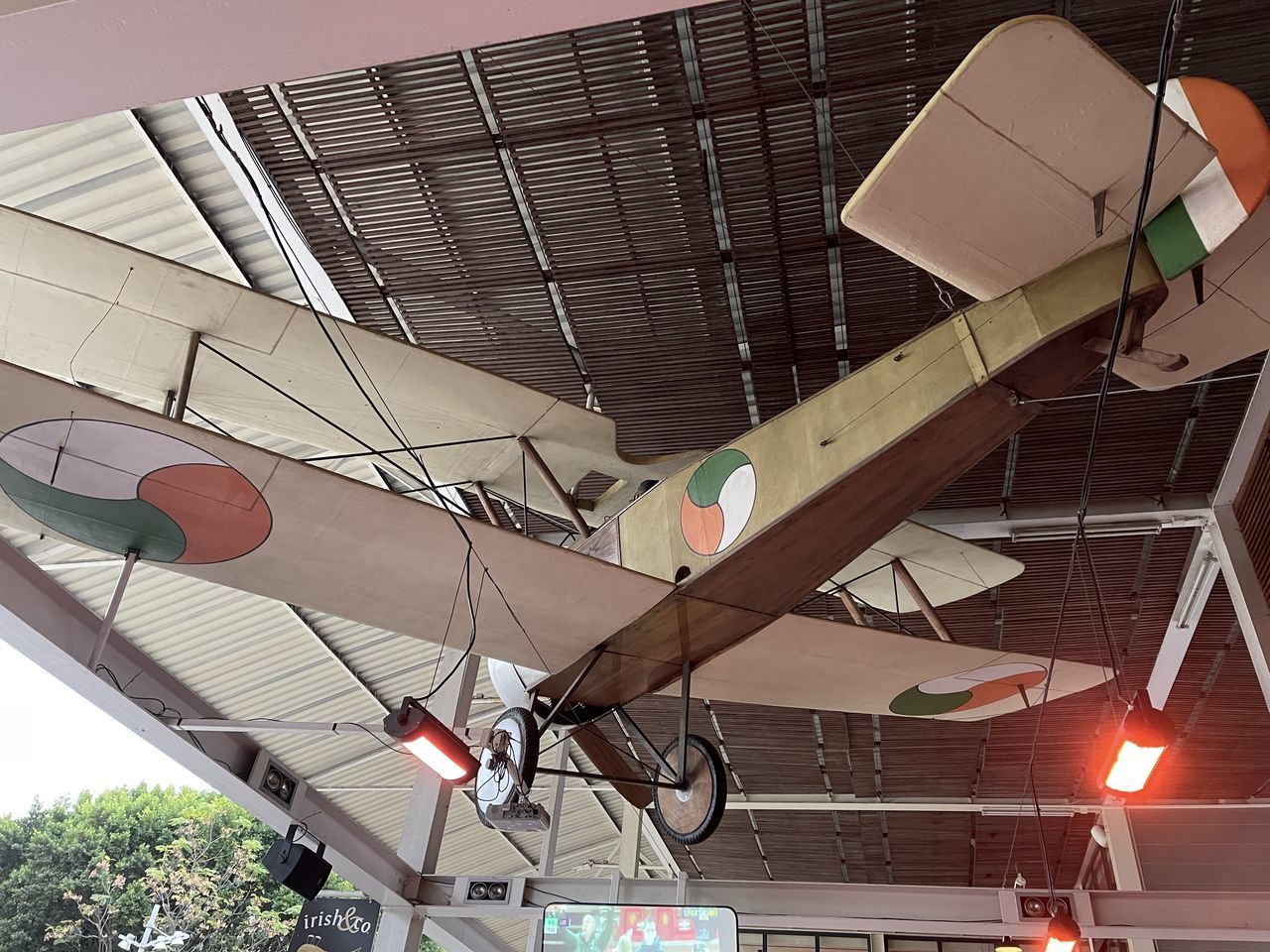 LOW ANGLE VIEW OF ILLUMINATED LIGHTING EQUIPMENT HANGING ON CEILING