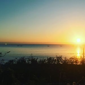 Scenic view of sea against clear sky during sunset