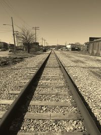 Surface level of railroad tracks against clear sky