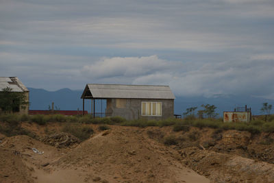 House on field against sky