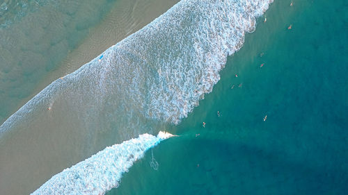 Top view of ocean beach. calm seascape with white foam and sand. travel and leisure concept.