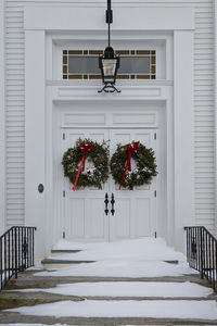 Wreaths on the doors of a white church