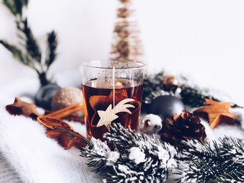 Close-up of christmas decorations and tea 